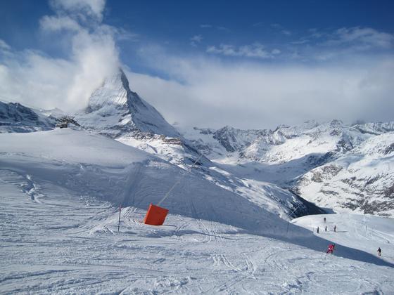 The Matterhorn, somewhat veiled in clouds, overlooking the Gornergrat ski slope above Zermatt in Switzerland's Alps.