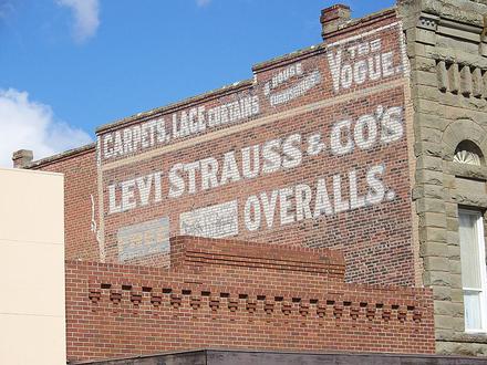 A Levi Strauss advertising sign painted on a brick wall in Woodland, California
